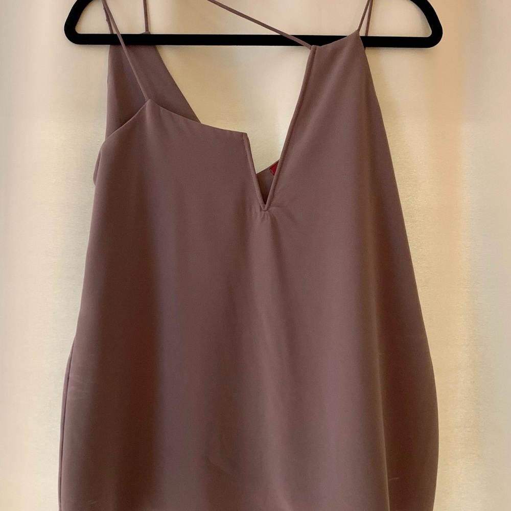 Top with asymmetrical neckline.